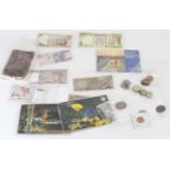 A collection of mixed coins and banknotes, to include British brass three-pence set