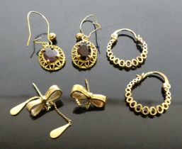 A pair of 9ct gold and oval cut garnet set ear pendants, on shepherd's crook fittings; together with