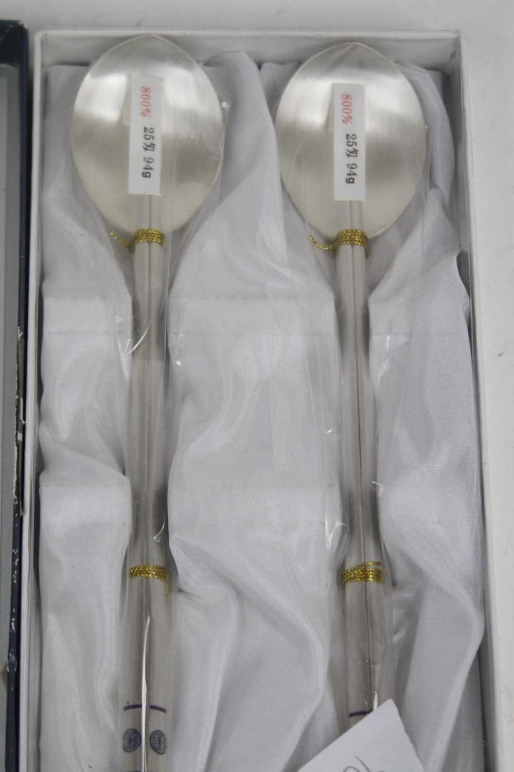 A Chinese white metal spoon and chopstick set, stamped 800, 6ozt, boxed - Image 2 of 2