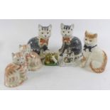 A pair of Rye pottery models of seated cats, together with various other cat figures, One of