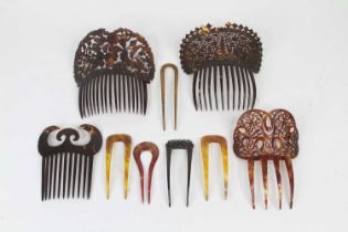 A collection of carved/faux tortoiseshell hair slides