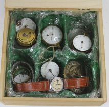 A collection of pocket watch parts, to include a fusee example