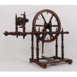 A turned wood spinning wheel, height 51cm