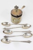 A George V silver mustard, of drum shape, having shell shaped thumbpiece and scroll handle, blue