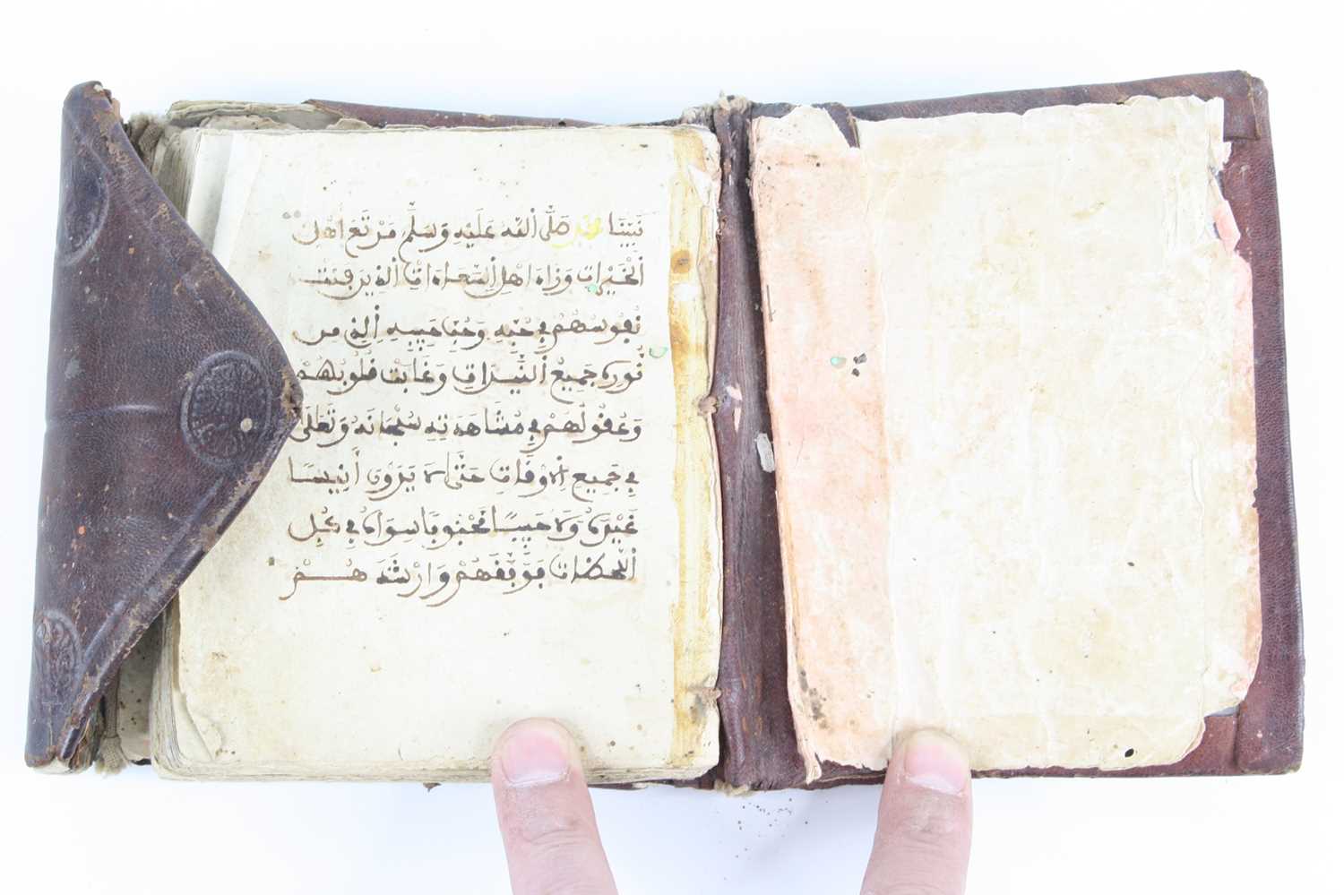 A 19th century North African Islamic book of prayer, each page having eight lines of maghribi? - Image 2 of 4