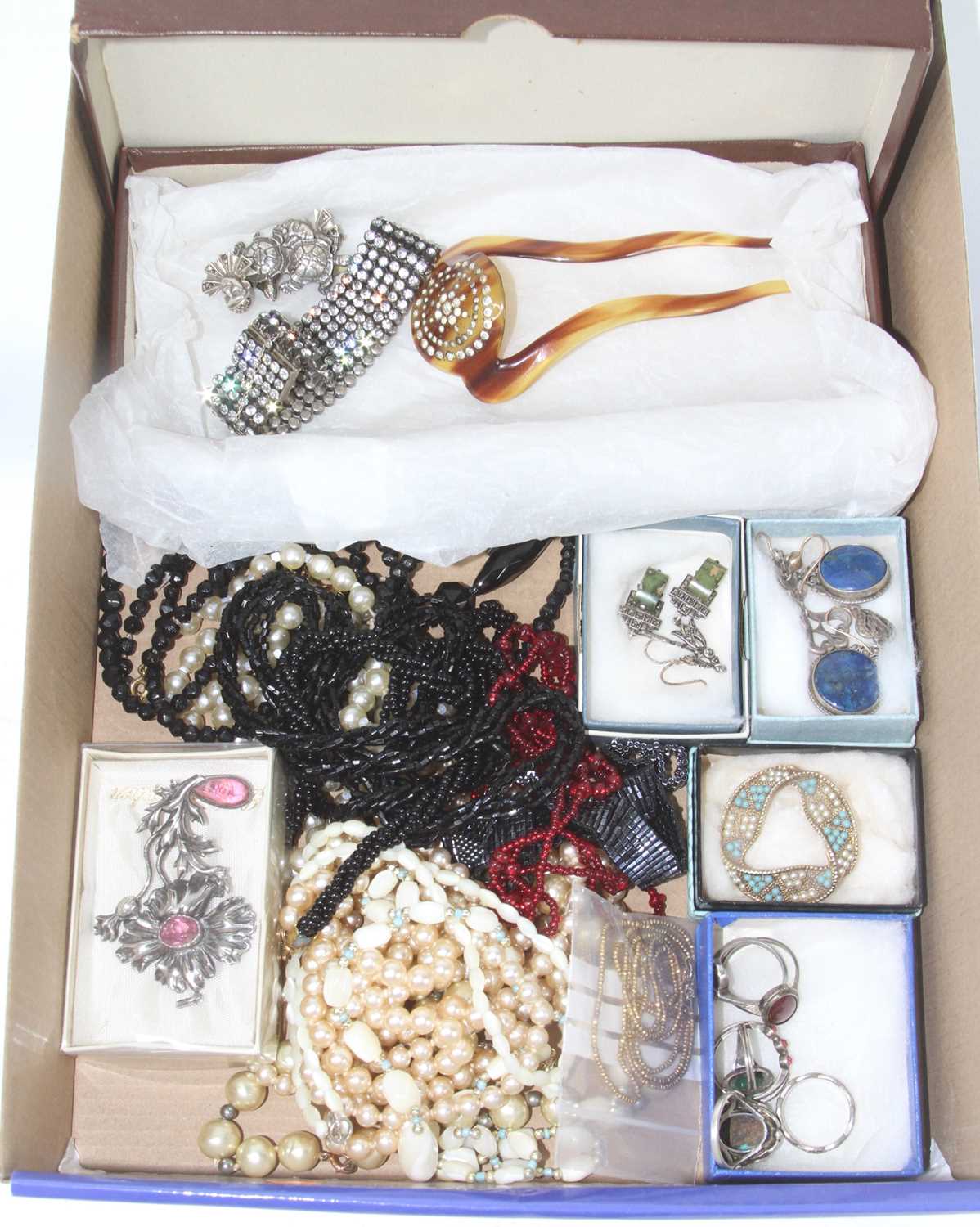 A collection of costume jewellery to include beaded necklaces, earrings, and rings