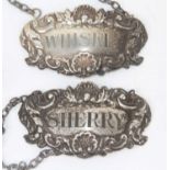 A pair of Elizabeth II silver decanter labels, one for Sherry and the other for Whiskey, London