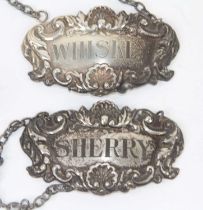 A pair of Elizabeth II silver decanter labels, one for Sherry and the other for Whiskey, London