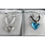 A Lalique clear glass heart shaped pendant, on rope neck chain, in box; together with a blue glass