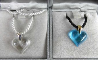 A Lalique clear glass heart shaped pendant, on rope neck chain, in box; together with a blue glass