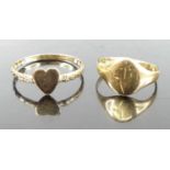 A yellow metal band ring, with heart shaped tablet, unmarked but tests as approx 9ct gold, 1g;