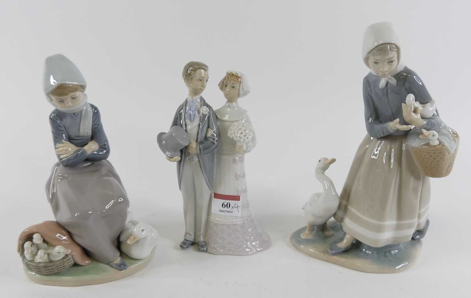 A Lladro Spanish porcelain figure of a bride & groom, having printed mark verso, height 19cm,