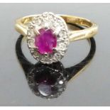 An 18ct gold, ruby and diamond oval cluster ring, 4.4g, sponsor HM, size O