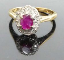 An 18ct gold, ruby and diamond oval cluster ring, 4.4g, sponsor HM, size O