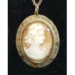 A carved shell cameo pendant in 9ct gold mount, cameo dimensions 32 x 24mm, on 9ct gold belcher link