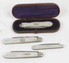 A collection of four silver bladed and mother of pearl handled pocket fruit knives