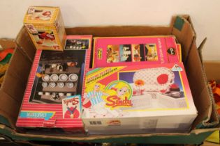 Three trays containing Sindy dolls related furniture and accessories to include dresser by Pedigree,