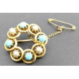 An Edwardian 15ct gold, turquoise and seed pearl set circular brooch, with safety chain, 4.8g, dia.