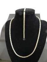 A contemporary Lavan Designer Jewellery silver necklace, having yellow metal ball dividers; together