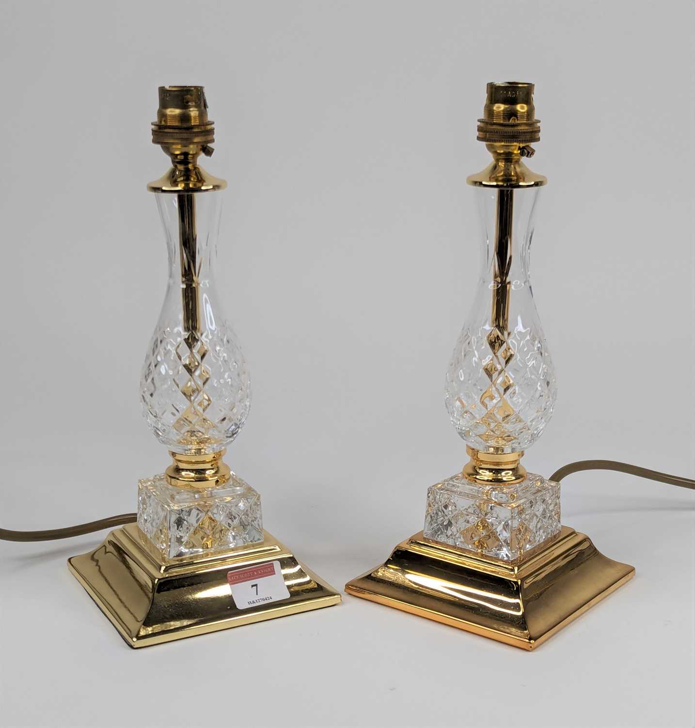 A pair of brass and glass table lamps, each of baluster form, height 27cm