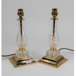 A pair of brass and glass table lamps, each of baluster form, height 27cm