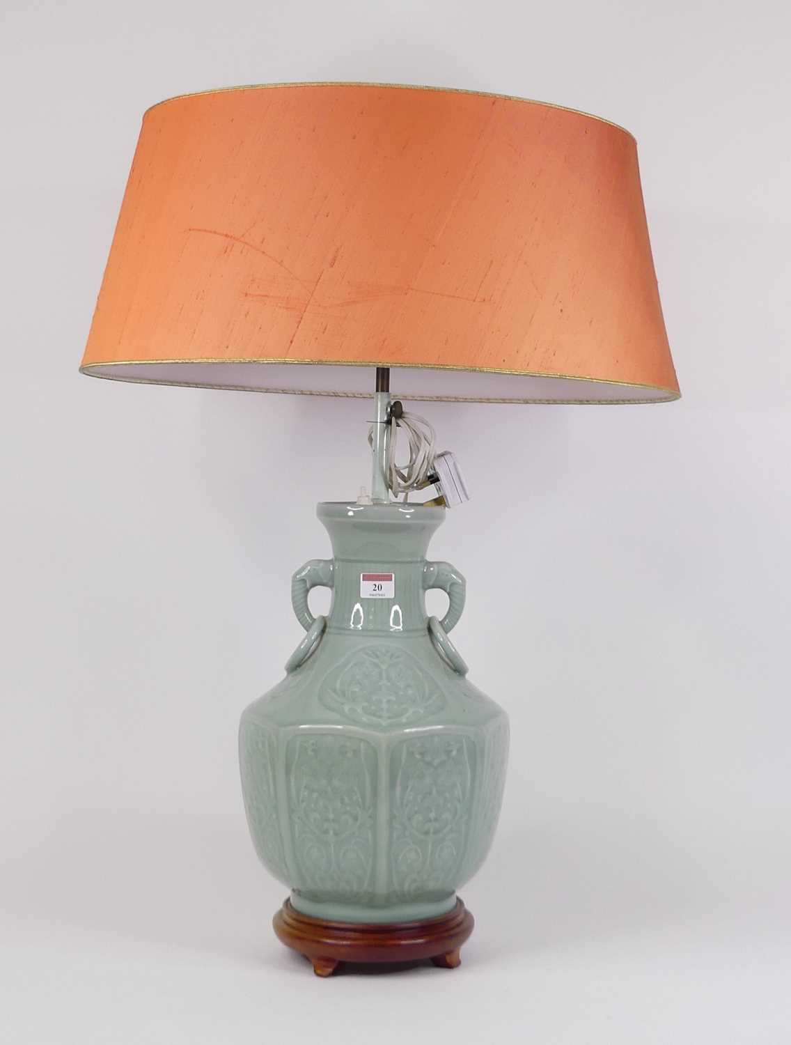 A Chinese celadon glazed table lamp, of baluster form, flanked by elephant mask ring handles, height