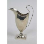 A George III silver cream jug, of helmet shape, Sheffield 1792, 4.3ozt