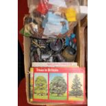 A small quantity of Britains farm lead and plastic figures, together with various booklets