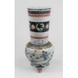 A Japanese porcelain vase, enamel decorated with flowers and dragons, height 36cm (a/f)