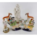 A collection of nine Victorian Staffordshire flat back figures, to include dogs, and a horseback