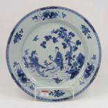 An 18th century Chinese blue & white porcelain charger, decorated with a figure and Phoenix, dia.