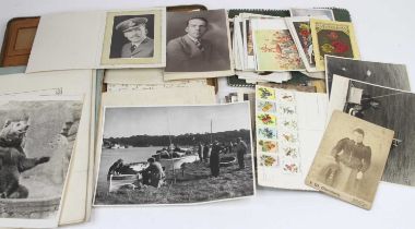 A collection of vintage stamps and postcards, and photographs