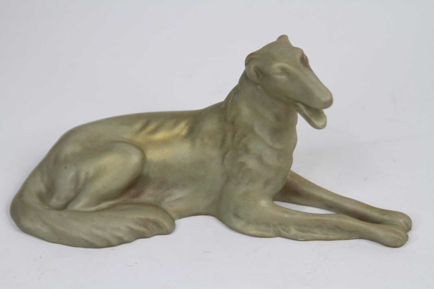 A Royal Dux gilt decorated model of a dog, length 19cm Good condition.
