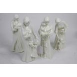 A collection of four Royal Worcester white glazed figures of mothers and children, the largest h.