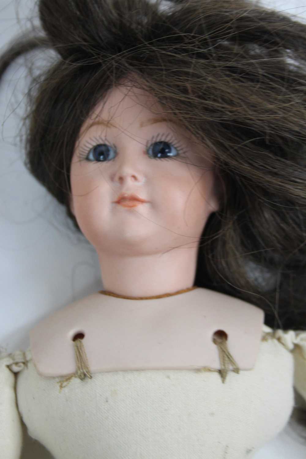 A Bruj bisque headed doll; together with two other similar (3) - Image 2 of 3