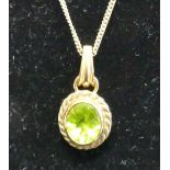 A 9ct gold and green peridot set pendant, on finelink neck chain, 7.2g