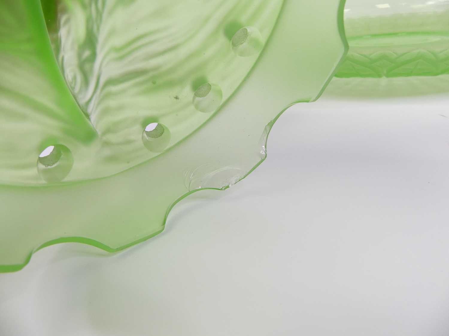 An Art Deco green glass centrepiece, in the form of a boy riding a fish, dia. 35cm Chips to the base - Image 2 of 2