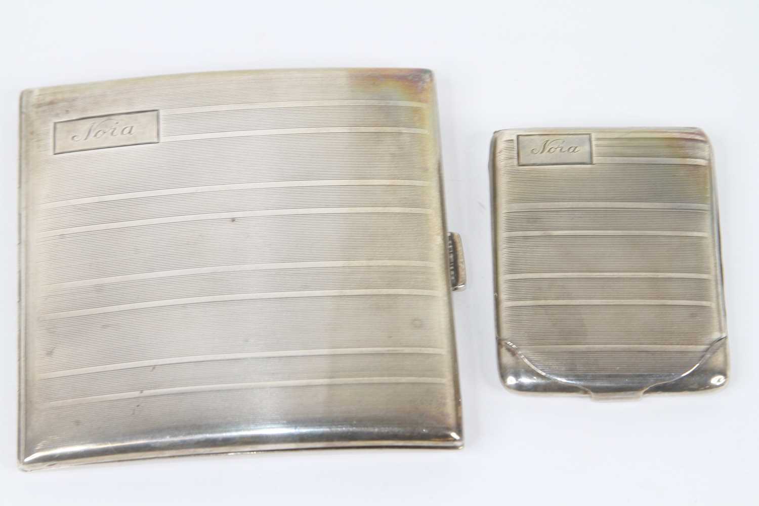 A George V silver cigarette case, of curved hinged rectangular form, having rectangular cartouche