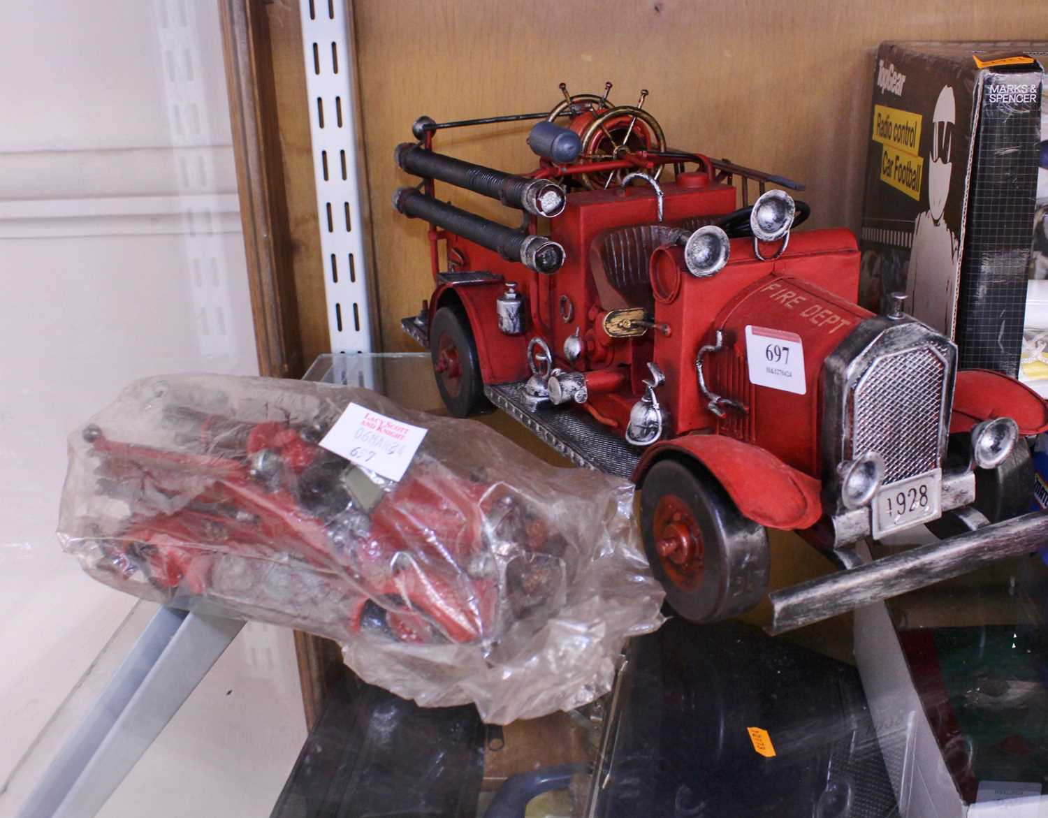 A Popular Imports model of a Fire Department engine together with one other example