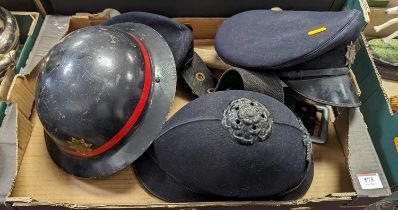 A British National Fire Service Brodie helmet, together with various other service uniform hats