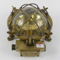 An early 20th century heavy brass ship's lantern, having a convex glass cover with screw fittings