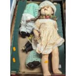 A collection of vintage dolls, to include a celluloid example with rolling eyes and two upper teeth