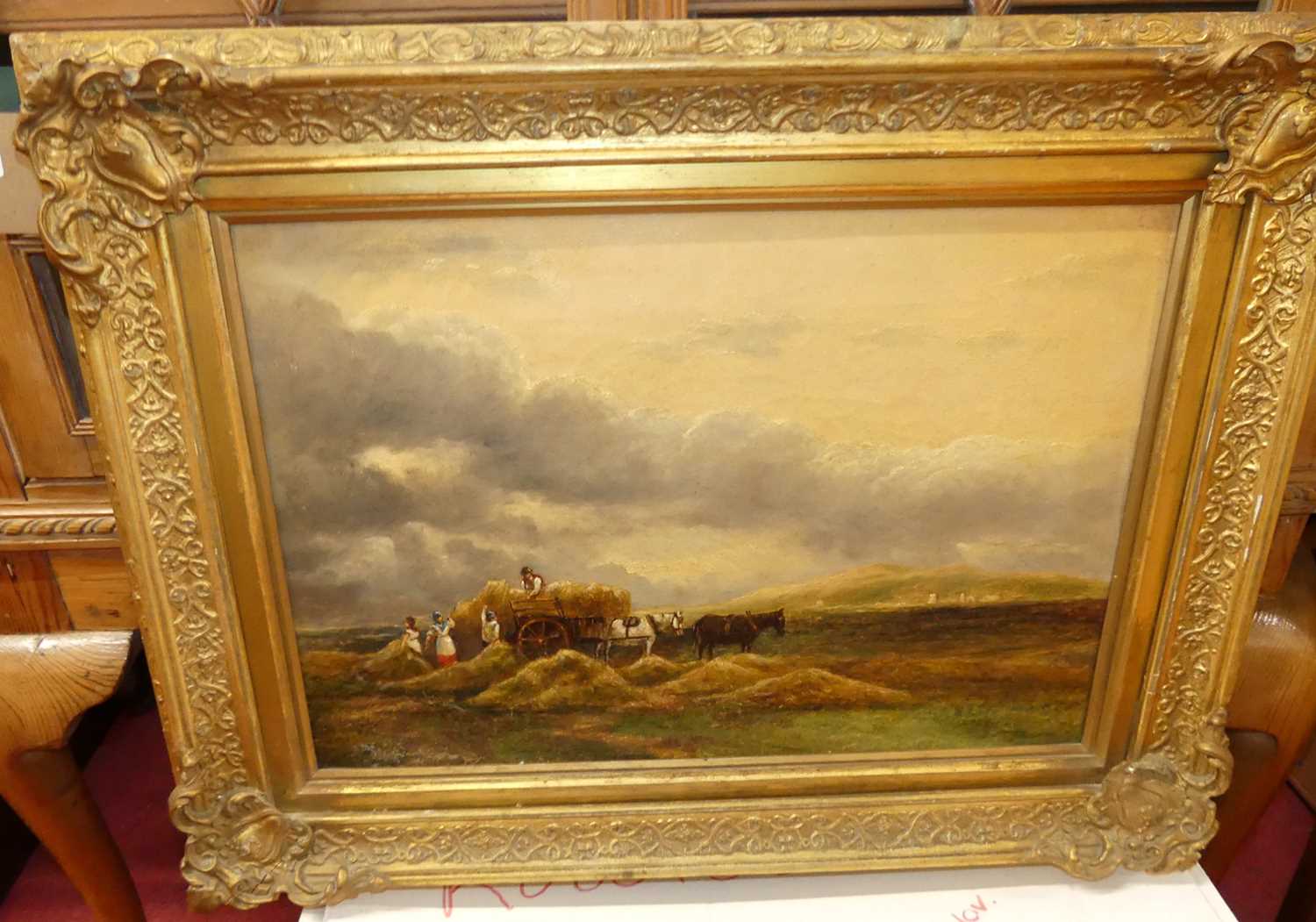 19th century English school - Loading the haycart under heavy skies, oil on canvas, 35 x 51cm
