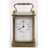 A reproduction French lacquered brass carriage clock, having visible platform escapement, twin