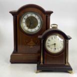 An Edwardian inlaid mahogany mantel clock having an Arabic chapter ring and eight-day brass cylinder