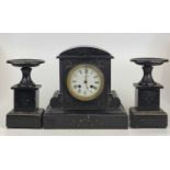 A late Victorian polished slate mantel clock, having white enamel dial, French brass eight-day