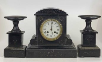 A late Victorian polished slate mantel clock, having white enamel dial, French brass eight-day