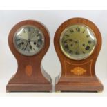 An Edwardian inlaid mahogany balloon shaped mantel clock, having unsigned silvered dial and spring-