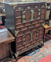 A Chinese elm and silvered metal mounted side cabinet, having four cupboard doors and four short