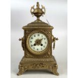 A late 19th century gilt brass (re-gilded) mantel clock having an unsigned white enamel Arabic dial,